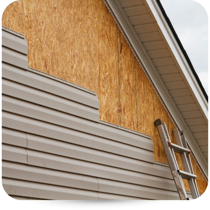 Brown siding is being put on.